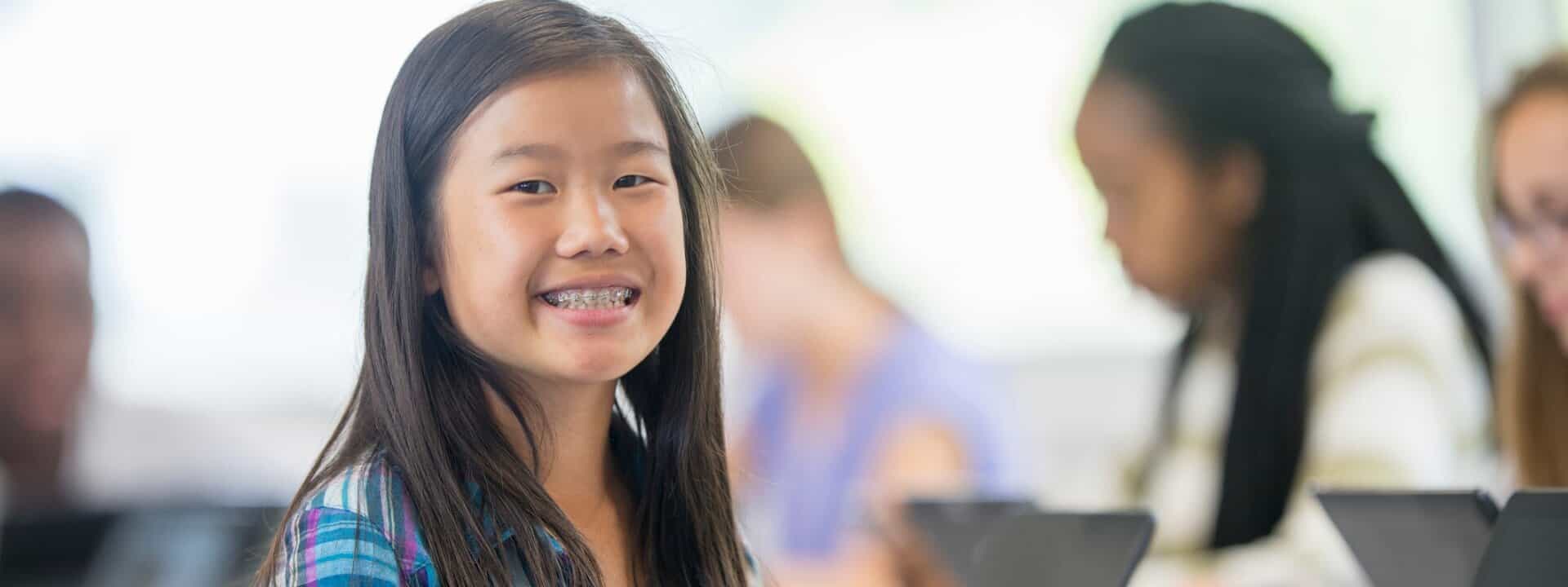 girl-smiling-in-class